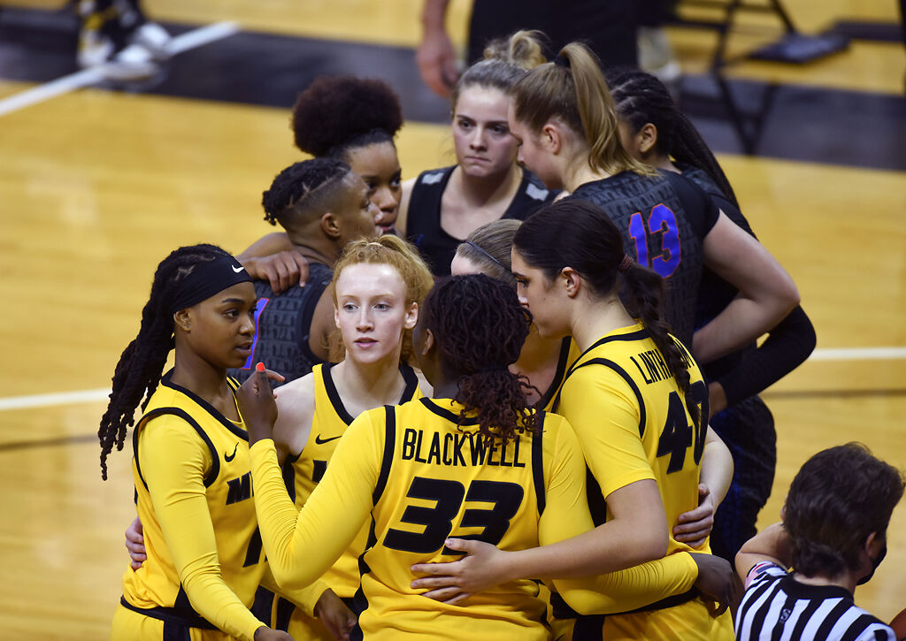 The team gathers for a pep talk in between plays with Florida's team